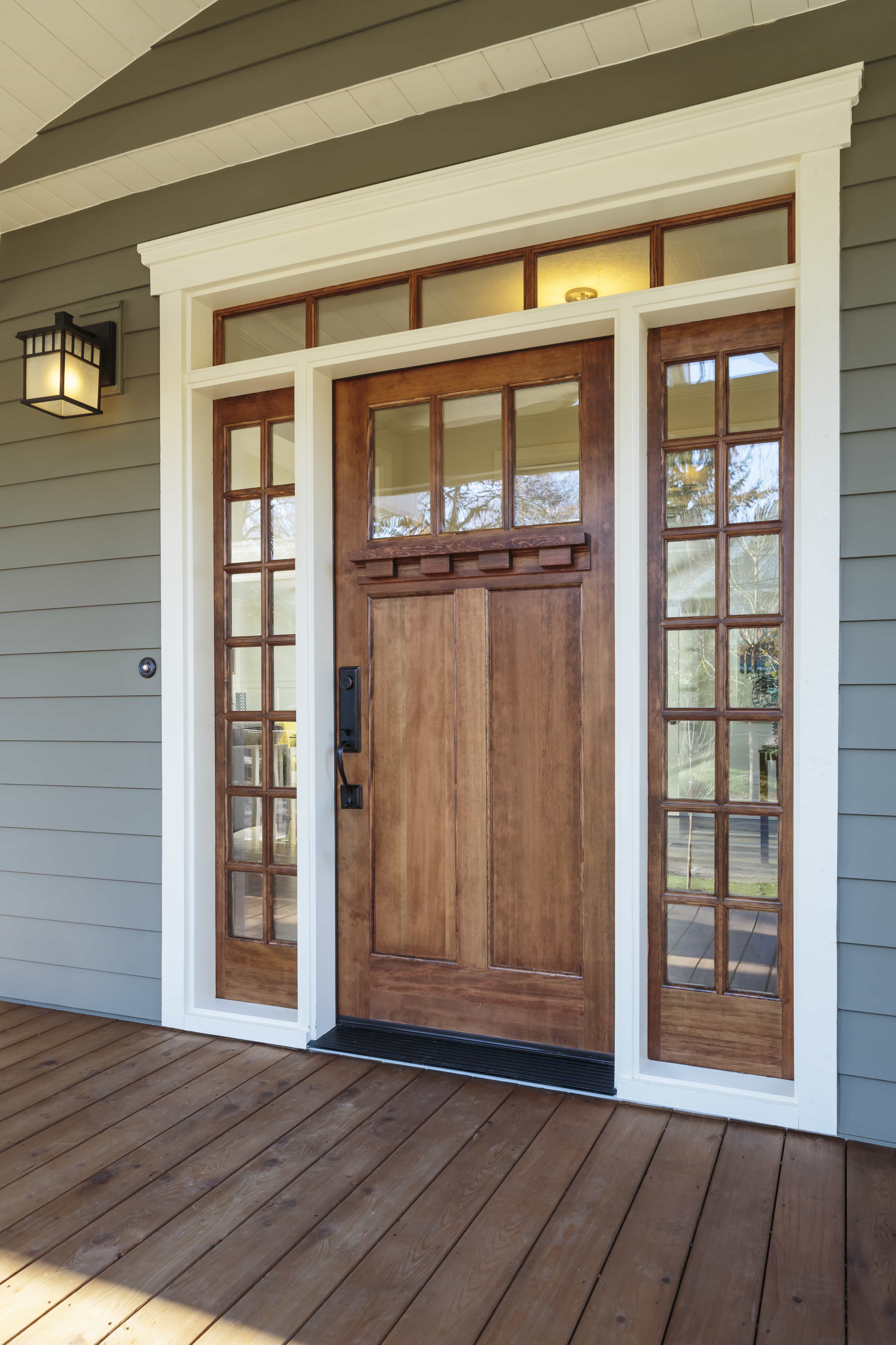 Wooden front door installation | Nansemond River Roofing & Siding